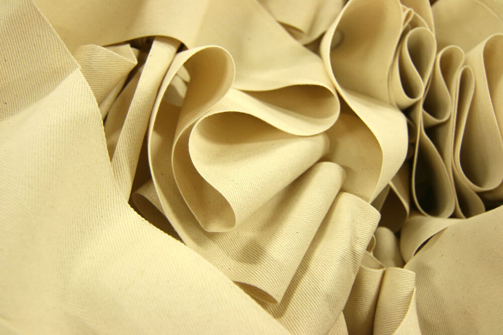 A large heap of faded yellow fabric